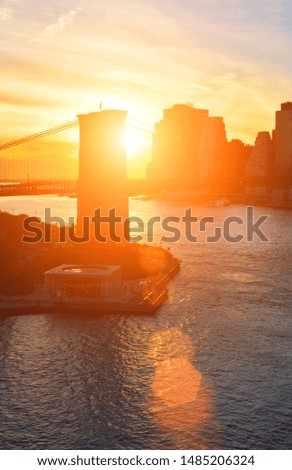 Beautiful sunset over a Manhattan and Brooklyn Bridge.