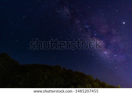 Starry night sky with the milky way galaxy in the top of the hill, astronomic picture