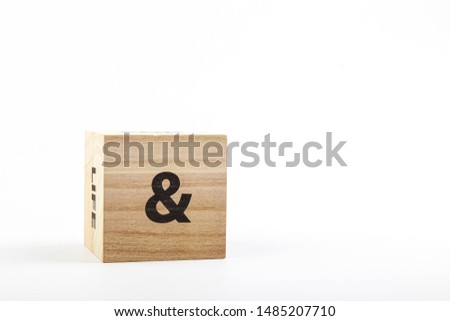 Wooden cubes with the inscription & on a white background close up