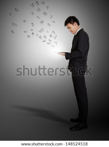 Businessman readind and has text in air from book