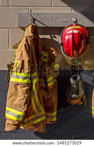 Firemen red helmet and protection clothes