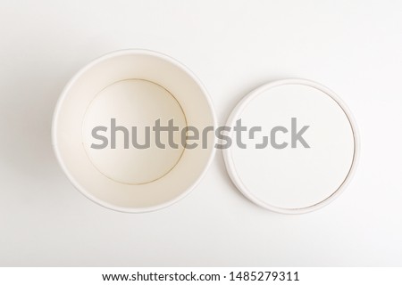 White paper cup with lid on white background. Empty paper cup with lid mockup on white background. Flat lay. Top view Royalty-Free Stock Photo #1485279311