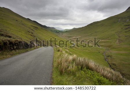 road going through mountain valley