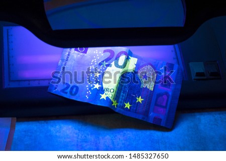 20 euro authentication. ultraviolet light shines on them Royalty-Free Stock Photo #1485327650
