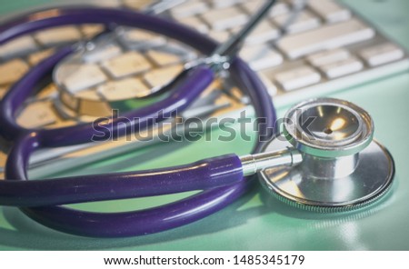 Doctor's workspace working table with patient's discharge blank paper form, medical prescription, stethoscope on desk