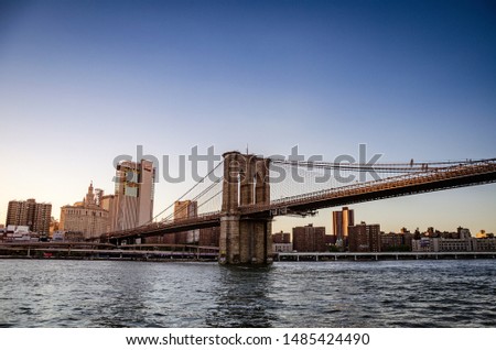 Brooklyn bridge and lower manhattan at sunset