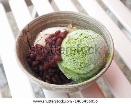 Matcha green tea ice cream with sweet bean paste on white background 

