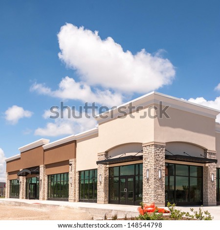 New Commercial, Retail and Office building Space available for sale or lease in mixed use Storefront and office building with awning Royalty-Free Stock Photo #148544798