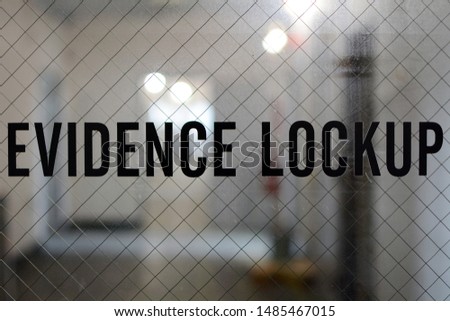 Evidence Lockup Sign on Window of Interior Door for Police Evidence Storage 