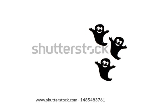 Black paper ghost on a white background. Halloween decoration and scary concept. Top View, Flat lay. Copy Space For Text.