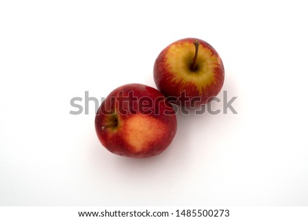 Fresh juicy group of red and green apples isolated on white background. Top view.