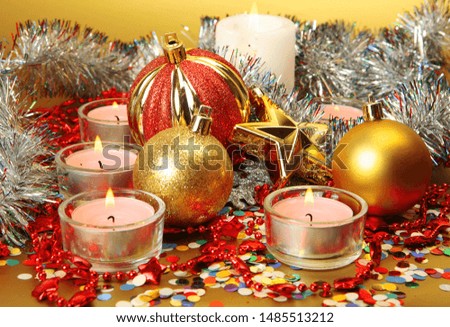 Christmas decorations and burning candles