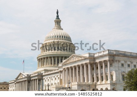 
The U.S. Capitol Building, facing east, home of Congress, and located atop Capitol Hill at the eastern end of the National Mall in Washington, D.C.  Royalty-Free Stock Photo #1485525812