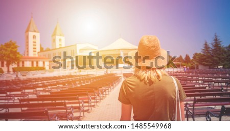 MEDJUGORJE, BOSNIA AND HERZEGOVINA Pilgrims praying in pews 