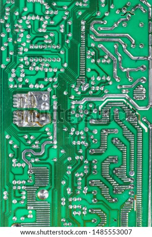Electronic microcircuit with microchips and capacitors taken closeup. -Image