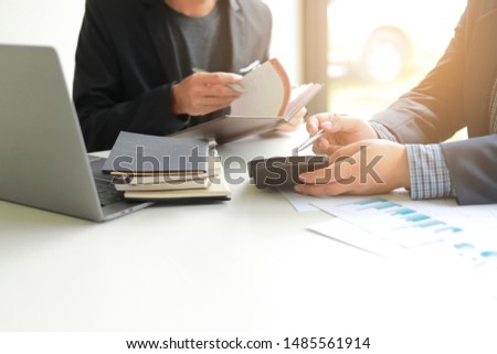 Business mans group working at office with laptop and documents graph on his desk Consultant is explaining solutions to his client
