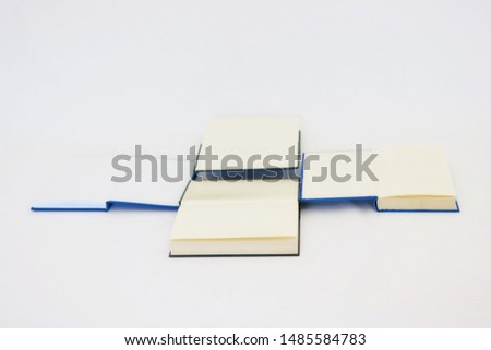 Opened books on white background