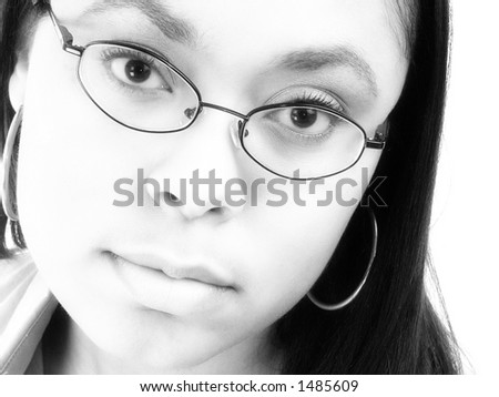 Black and white close up of beautiful African American woman in glasses.  Headshot. Serious expression.