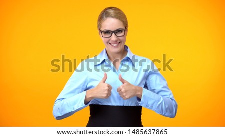 Joyful woman showing thumbs up, business training recommendation, achievement