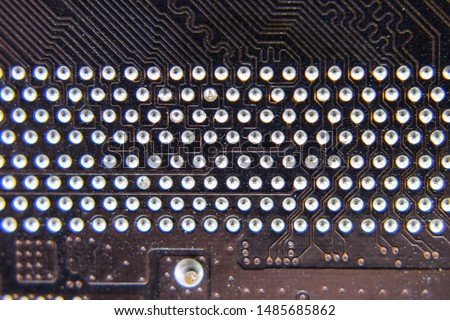 The reverse side of the microboard. Contacts solder. Soldered parts. Electronic board with electrical components. Electronics of computer equipment.