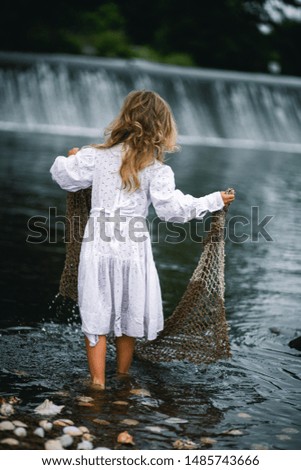 Portrait of the young girl in the water