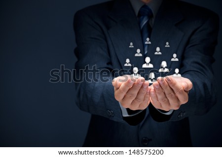 Customer care, care for employees, labor union, CRM, and life insurance concepts. Protecting gesture of businessman or personnel and glass cubes with icons representing group of people. Royalty-Free Stock Photo #148575200