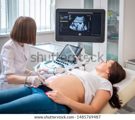 Pregnant woman on utltrasonographic examination at hospital Royalty-Free Stock Photo #1485769487