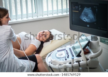Pregnant woman on utltrasonographic examination at hospital Royalty-Free Stock Photo #1485769529