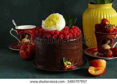 chocolate cake with raspberries and yellow peony flower. Chocolate Raspberry Dessert