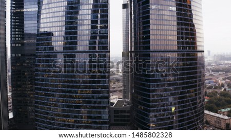 Glass and concrete skyscrapers, business centers. aerial flight