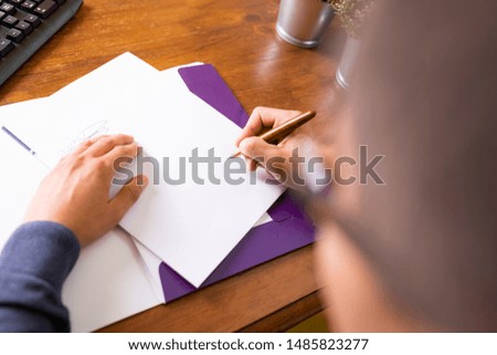 Signing a document. The man signs the document with a fountain pen