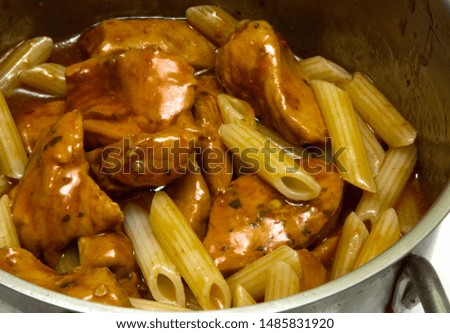 Homemade Barbecue Chicken Breast with Short Pasta in pan