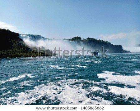 The waterfall with blue and white wave in the sea.