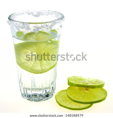 vodka glass , lemon and salt for drink