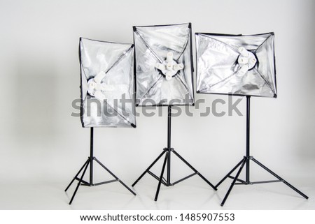 Studio lighting isolated on white background with stands