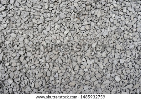 Dirty gravel ballast background. Small gray dusty broken stones texture. Top view Royalty-Free Stock Photo #1485932759