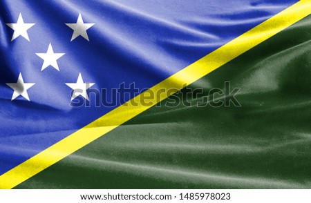 Realistic flag of Solomon Islands on the wavy surface of fabric