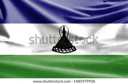 Realistic flag of Lesotho on the wavy surface of fabric