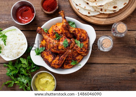  Tandoori chicken with jasmine rice and pita bread, indian cuisine. Royalty-Free Stock Photo #1486046090