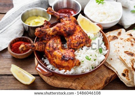  Tandoori chicken with jasmine rice and pita bread, indian cuisine. Royalty-Free Stock Photo #1486046108
