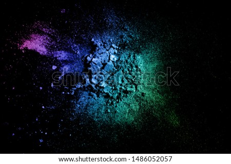 Crushed eyeshadow texture. Neon palette makeup powder swatch isolated on black background
