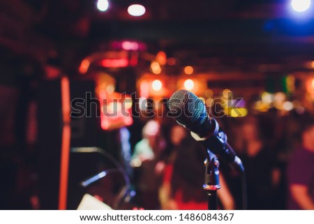 Microphone. Microphone close-up. A pub. Bar. A restaurant. Classical music. Music. Royalty-Free Stock Photo #1486084367