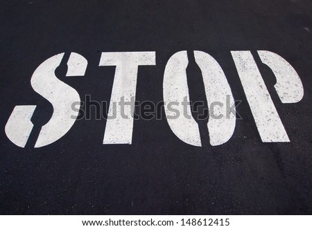 Stop sign painted on the road