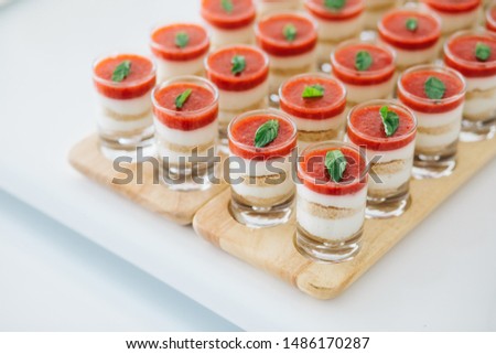 stewed magnolia dessert in glass cup on wooden background.