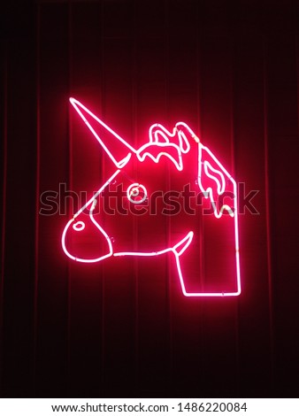 Beautiful red unicorn lights on the wall