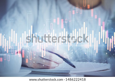 Forex chart displayed on woman's hand taking notes background. Concept of research. Multi exposure