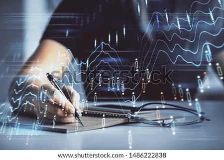 Multi exposure of woman's hands making notes with forex graph hologram. Concept of technical analysis.