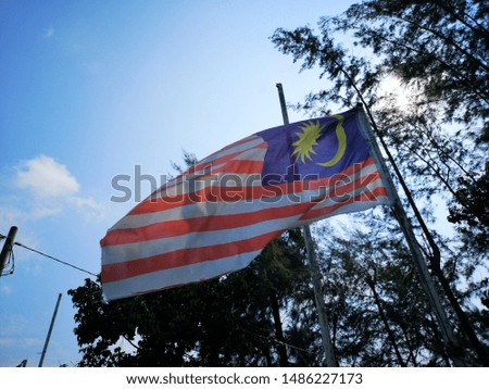 Malaysia flag in wind with selective focus.