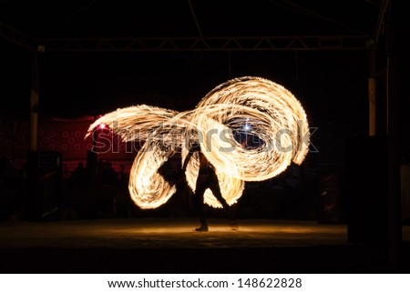 Dancing with the fire Royalty-Free Stock Photo #148622828