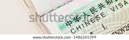 Close up of a Chinese Visa for travel in China background,banner size